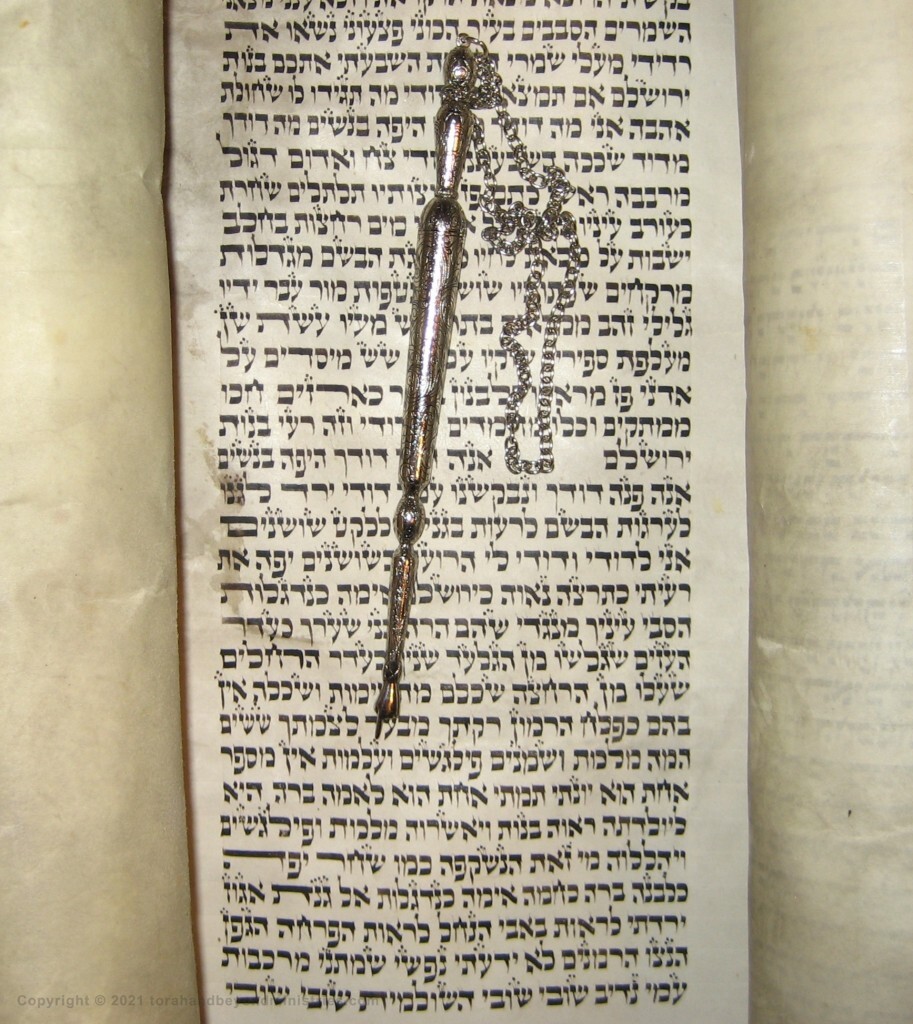 The yad, pointer, is showing the Hebrew word almah which is virgin, the same word used in Isaiah 7:14.
