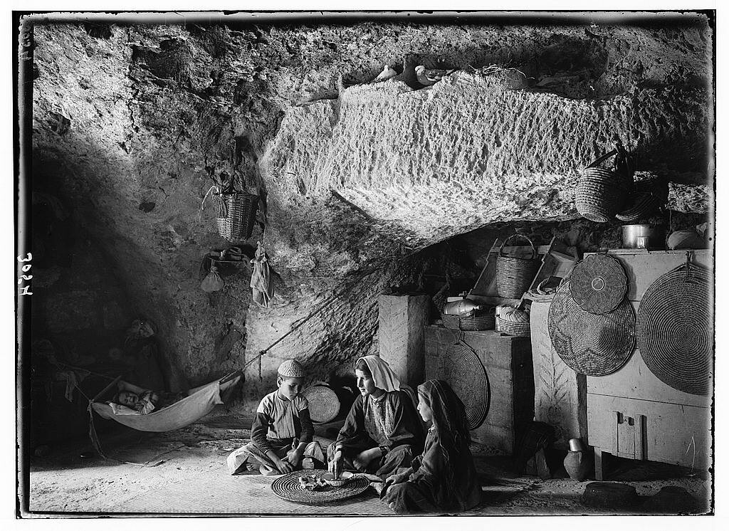 This Family lived in a cave built to shelter animals. The photograph was taken around 1890 near Bethlehem.