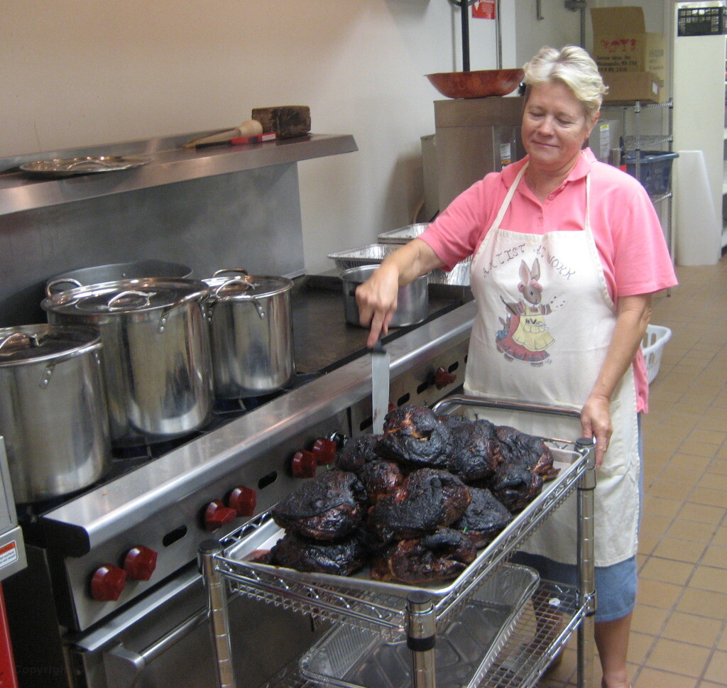 Artis cooking roast lamb for Passover Seder