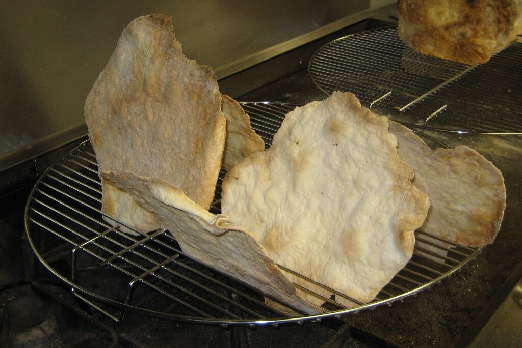 Homemade Unleavened bread cooling on wire racks