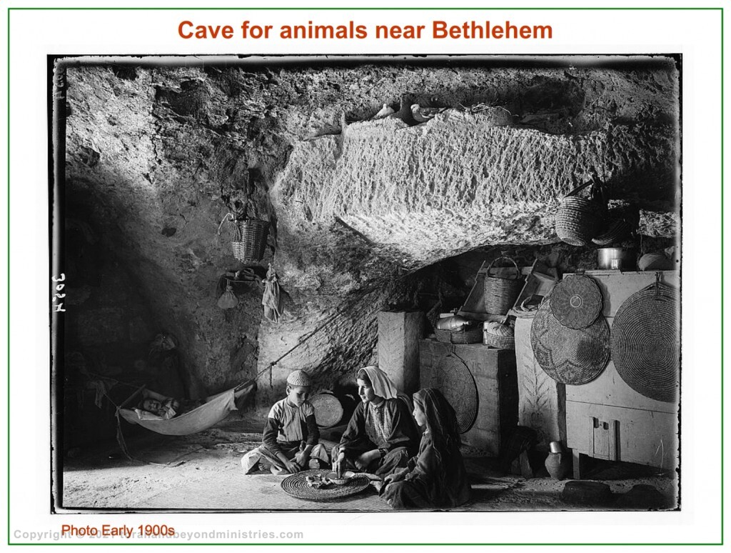 A family is living in a small cave originally made for animals near Bethlehem. Photo early 1900s
