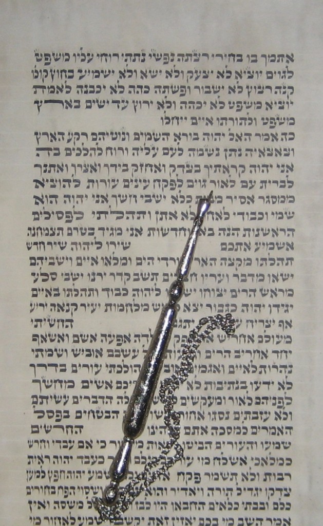 The following photograph is from the Scroll of Isaiah written in Poland sometime in the 19th century. The yad (pointer) is pointing to the word light. This has always been considered to be a Messianic passage from Isaiah.