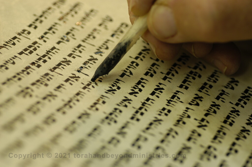 Scribe re-lettering a Torah Scroll to keep it kosher