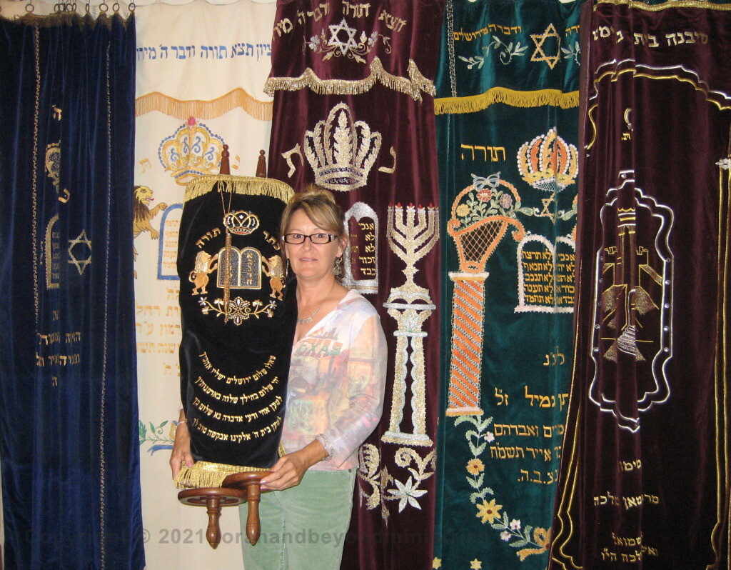 Scriptorium Scroll display guest holding the Torah