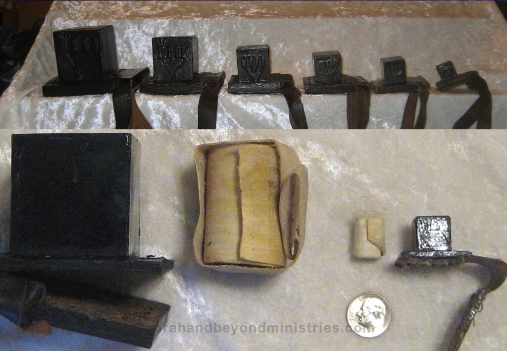Various size Tefillin also called phylacteries are a set of small black leather boxes containing scrolls of parchment inscribed with verses from the Torah,