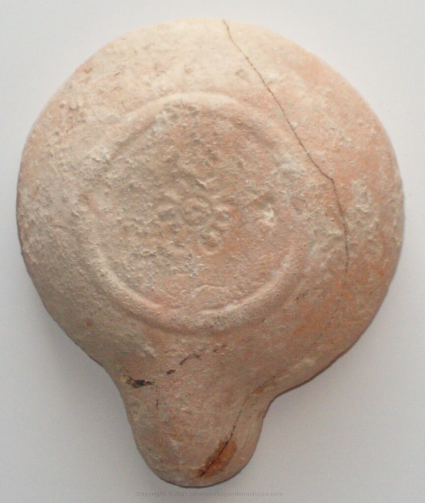 Oil Lamp found in Israel shows the crocus flower on the bottom